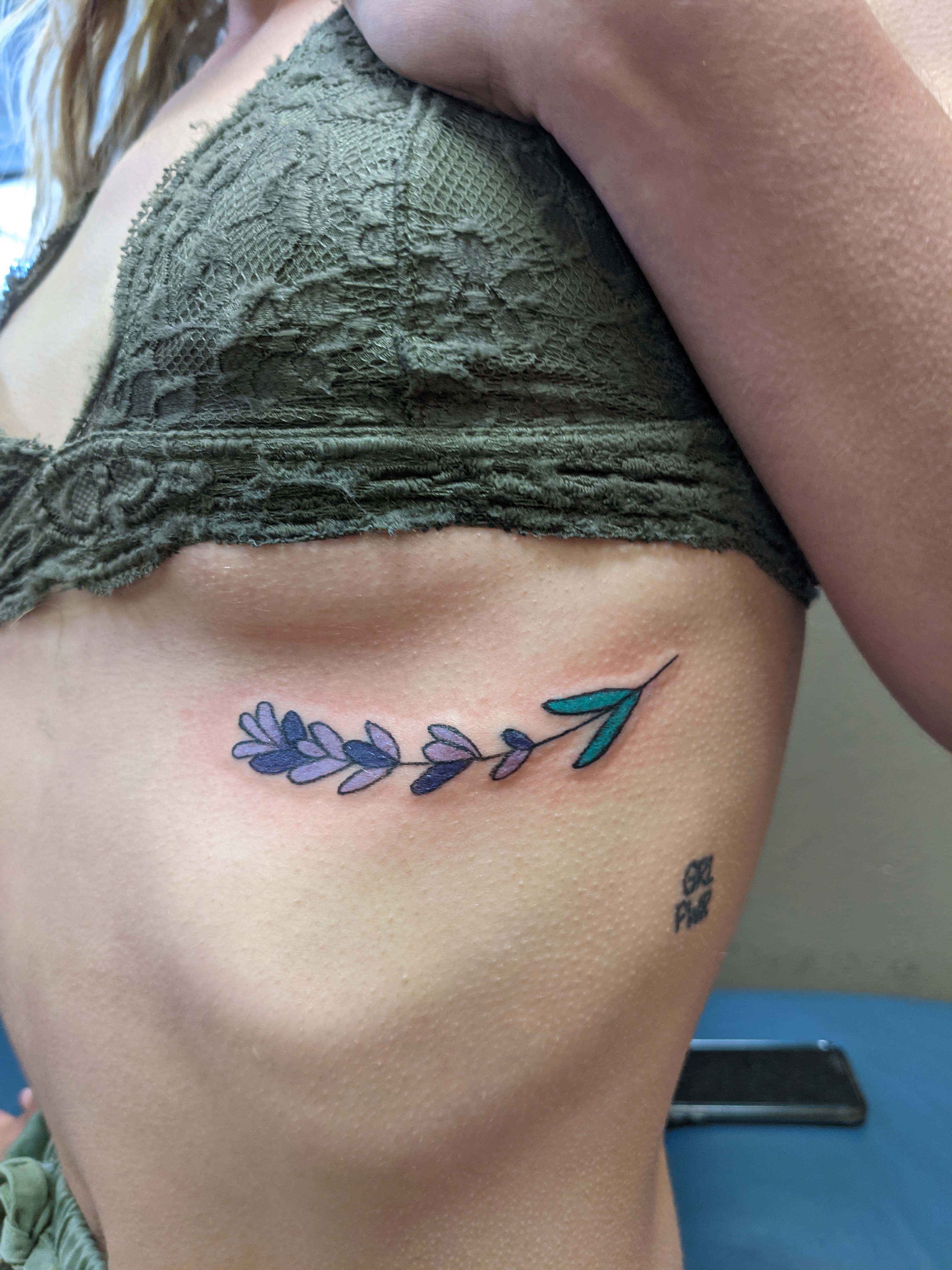 Image of a Lavender sprig tattoo on the ribs